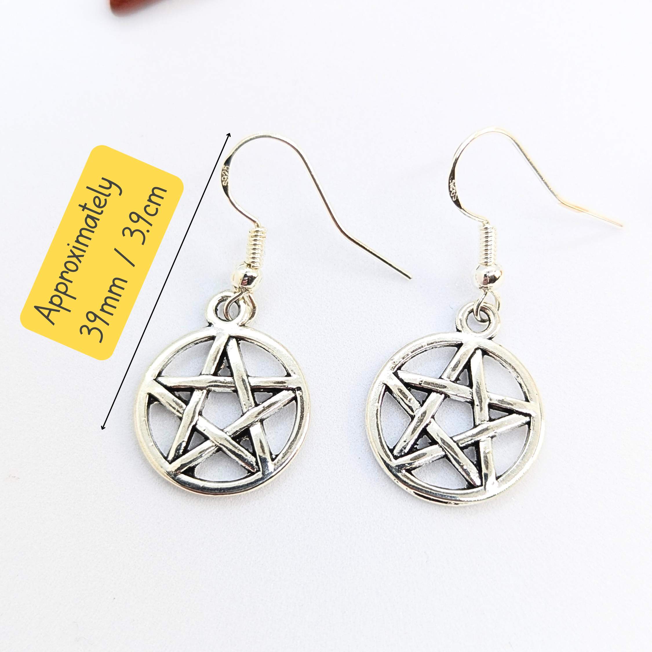 A pair of Silver Sunbird Pentagram Earrings with hooks is shown on a white background. The text “Approximately 31mm / 1.3 in” highlights their size—perfect subtle Wicca-inspired jewelry for those seeking pagan symbolism.