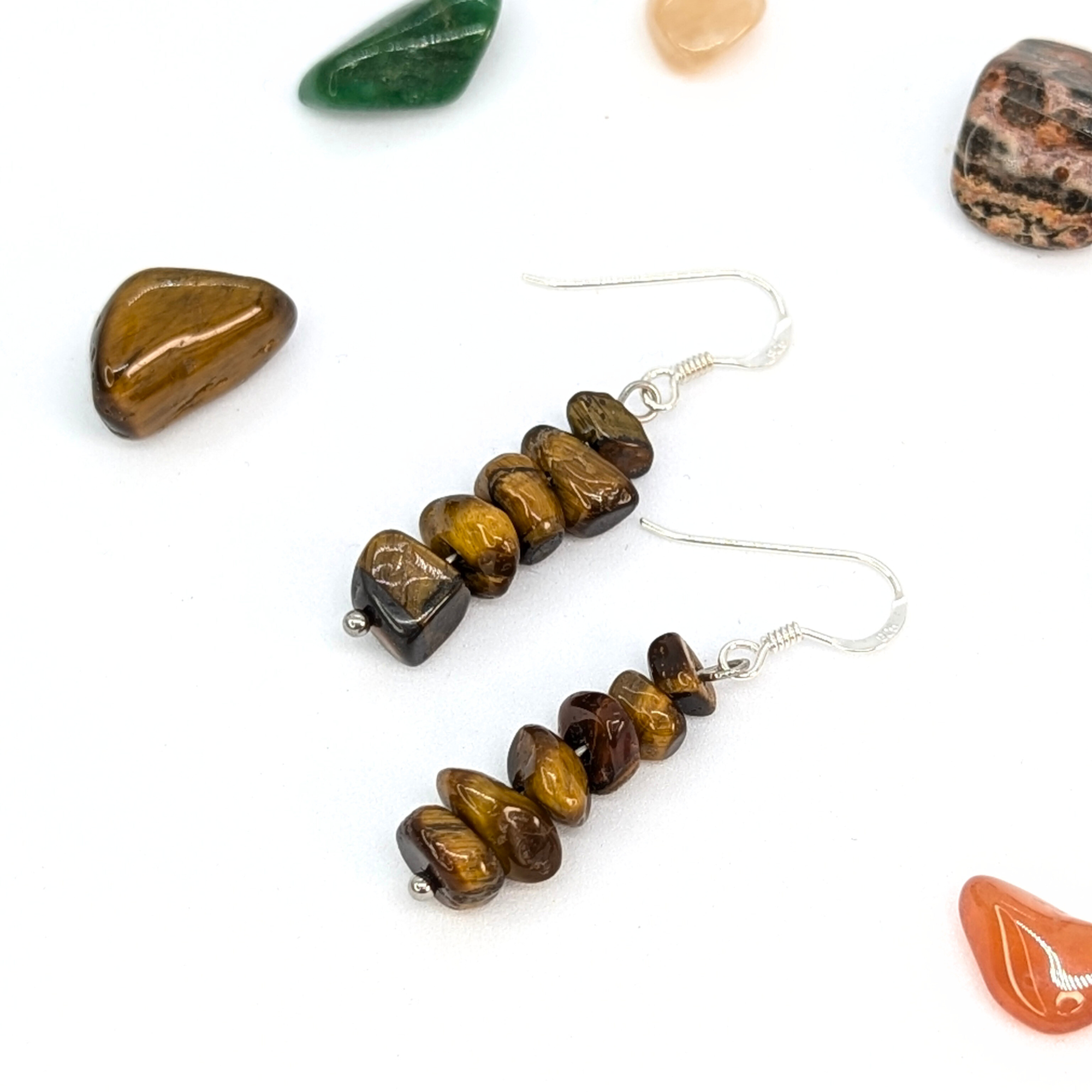 Silver Sunbird Tiger’s Eye Earrings feature stacked brown and gold stones, accented by assorted polished gemstones—a standout piece of Bohemian jewellery.