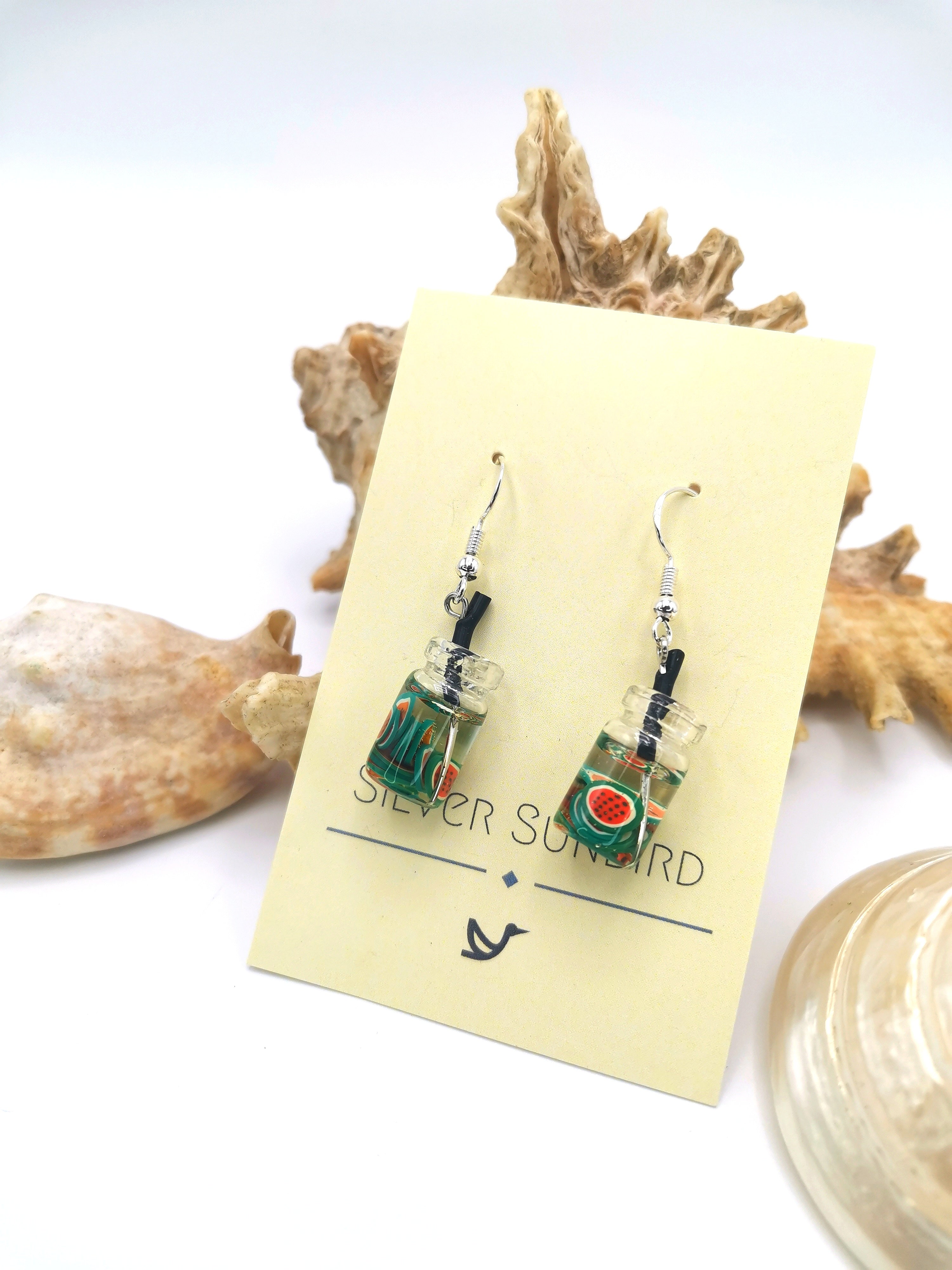 The Party Cocktail Earrings by Silver Sunbird are handmade with miniature sushi rolls in tiny glass jars, beautifully displayed on a card.