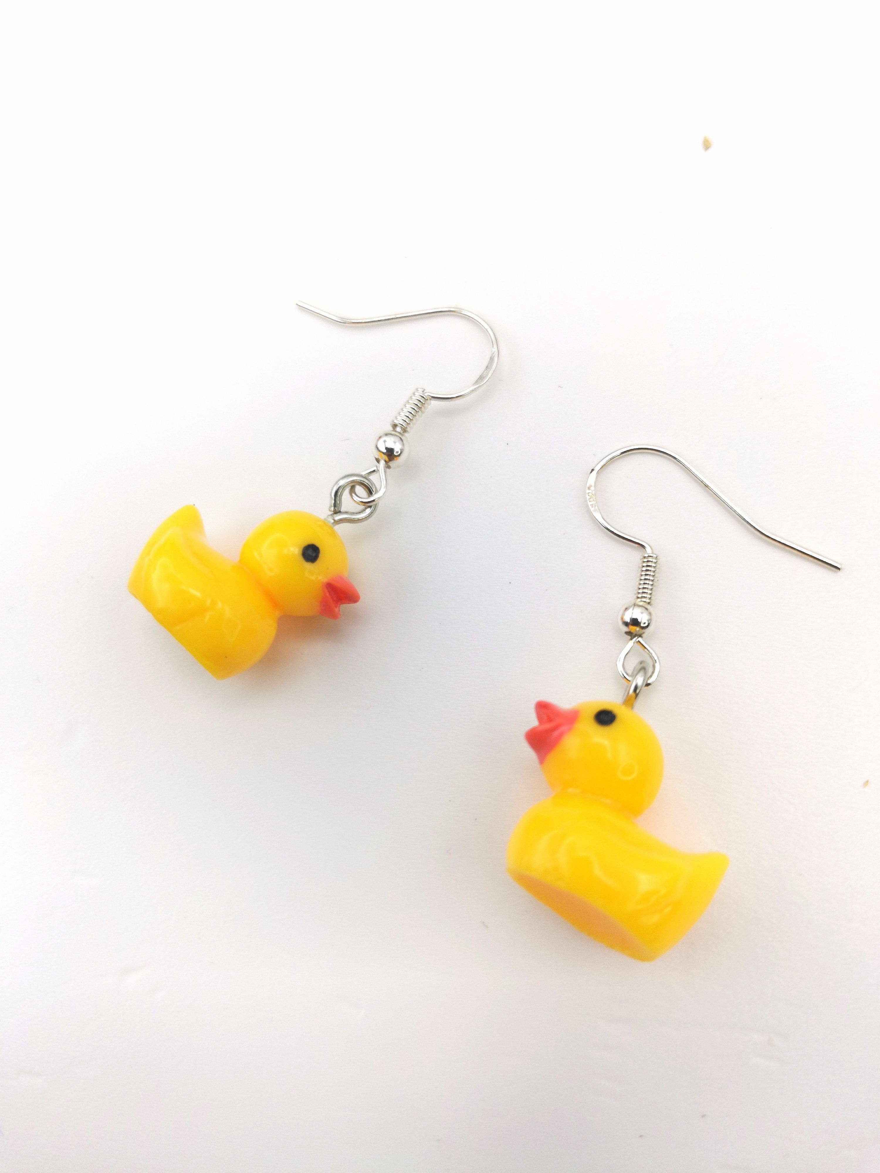 The Silver Sunbird Young Hearted Yellow Ducks Earrings feature charming yellow duck charms on silver hooks—perfect for quirky jewellery lovers and anyone with a playful sense of style.