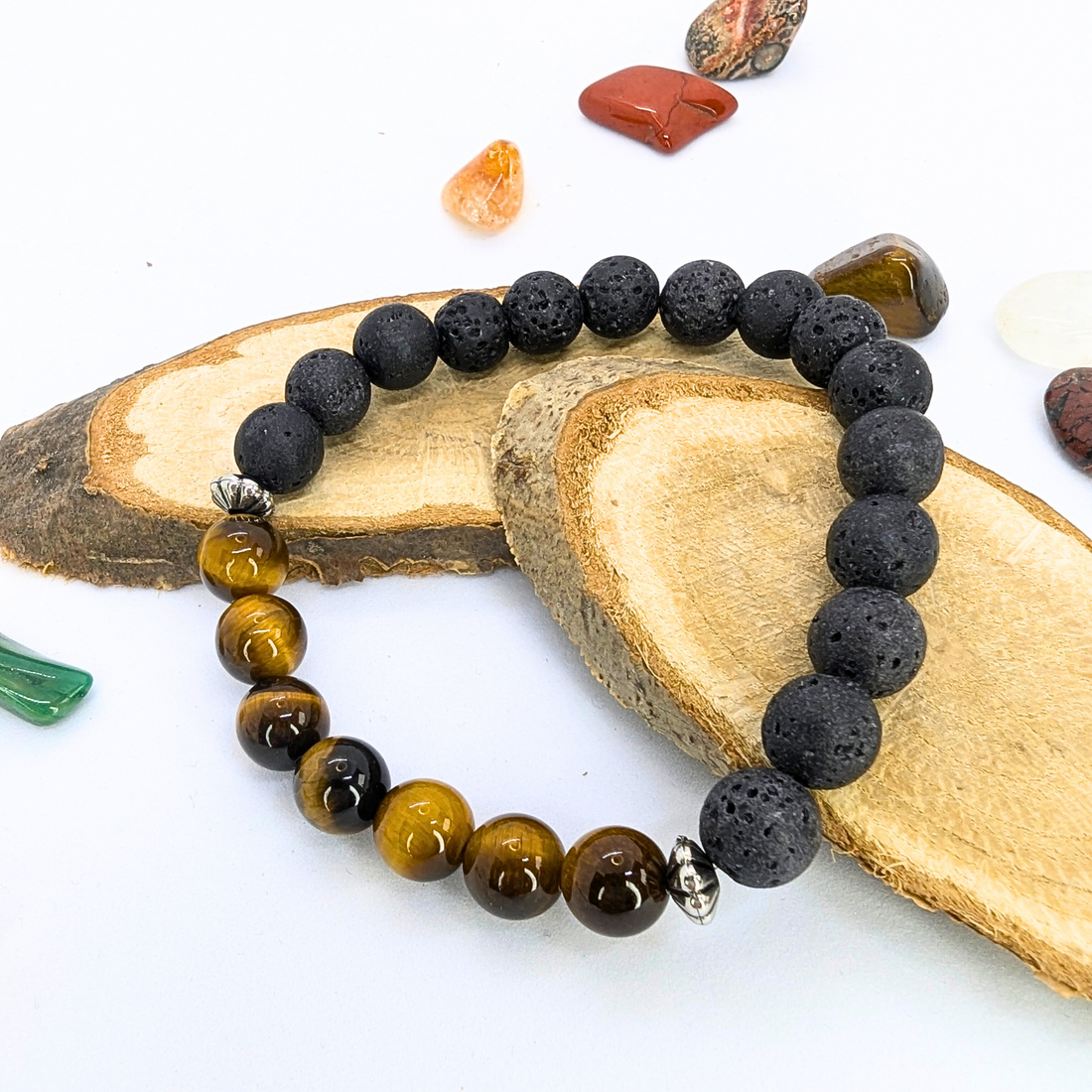 The Silver Sunbird Tiger Eye and Lava Stone Bracelet, showcasing black lava stone and polished tiger&