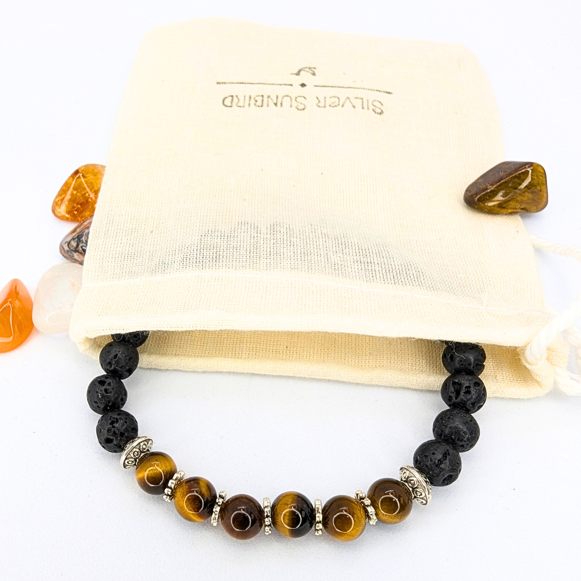 The Silver Sunbird Tiger Eye and Lava Stone Bracelet, made with black lava beads, brown tiger&