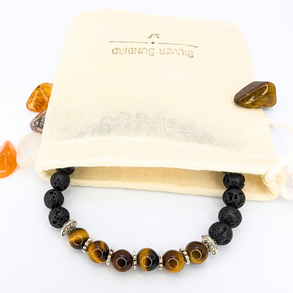 The Silver Sunbird Tiger Eye and Lava Stone Bracelet, made with black lava beads, brown tiger&