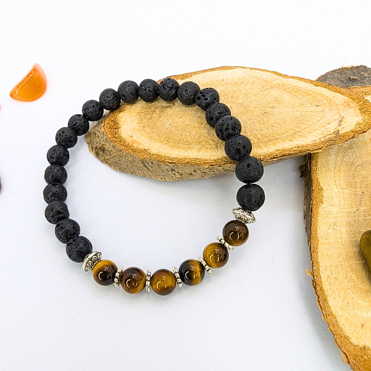 The Silver Sunbird Tiger Eye and Lava Stone Bracelet blends black lava stones and brown tiger&