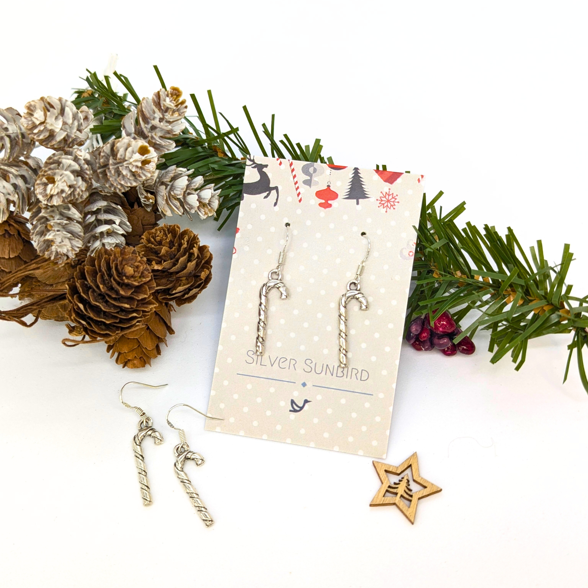 Classic Candy Cane Earrings by Silver Sunbird, presented on a festive card with holiday accents—perfect Christmas jewelry for the season.